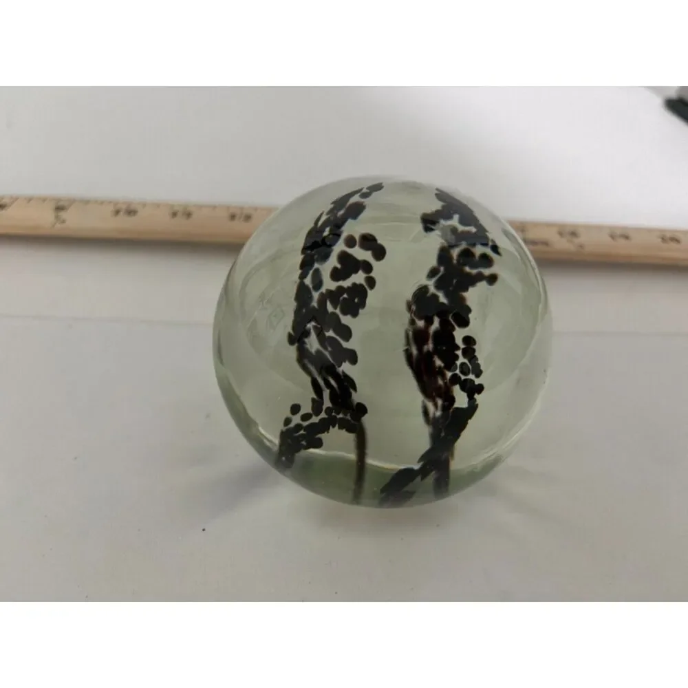 Vintage art glass paperweight with black Inclusions